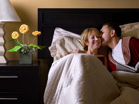 Couple reading in bed